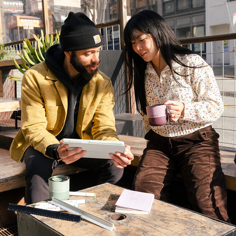 12oz-rise-mug-j7 12oz_rise_coffee_mug_dusty_orchid_couple_city_patio_square.jpg