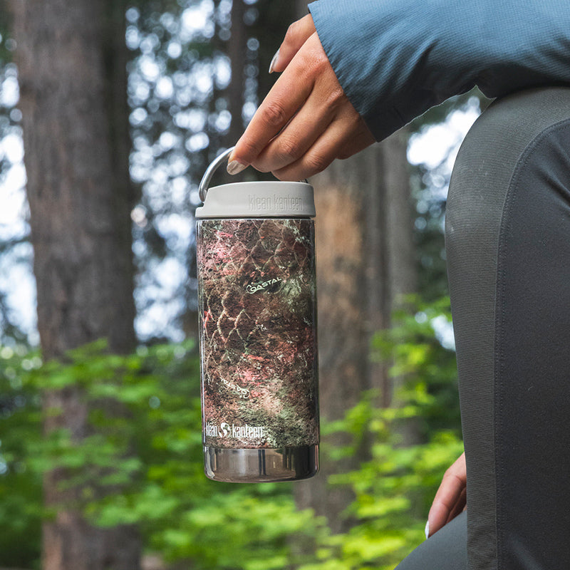 12oz-tkwide-with-twist-cap-mossy-oak-c9 12oz_tumbler_mossyoak_rainbowtrout_hand_closeup_square.jpg