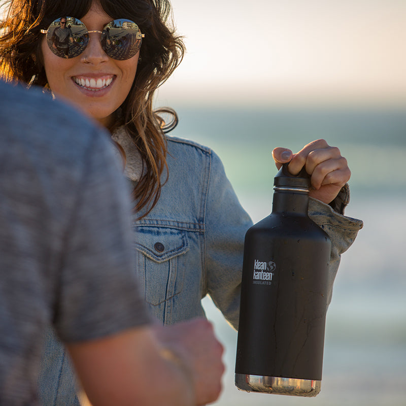 64oz-classic-with-loop-cap-x2 64oz_insulated_classic_black_beach_girl_hand_square.jpg