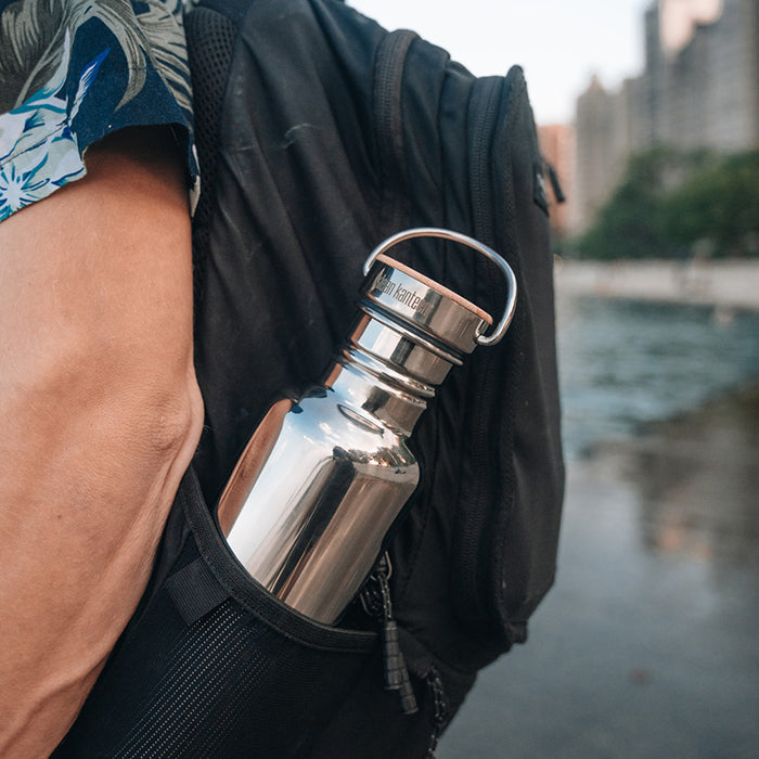 27oz-reflect-with-bamboo-cap-n7 K27SSLRF-MS-BAMBOO_reflect-bottle_backpack_lifestyle.jpg